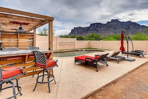 There is a poolside bar, an outdoor shower, and lodging chairs available for your enjoyment.