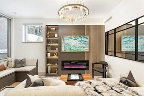 Living room featuring a Samsung frame smart TV & queen sleeper sofa