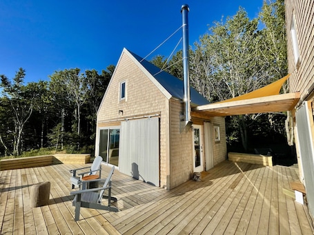 Two cabins (one living rm./kitchen, other bedrm. /bathroom ) surrounded by decks