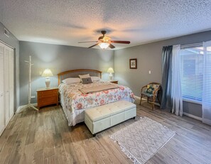 Spacious master bedroom with comfortable king bed