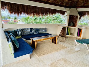 Sitting area under rooftop palapa