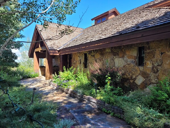 House with stone walls and landscape