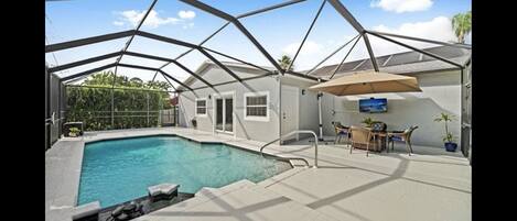 Outdoor area - saltwater pool, Weber grill, lounge chars, fire table, TV