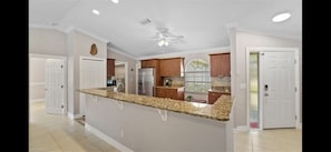 Open kitchen with bar stools