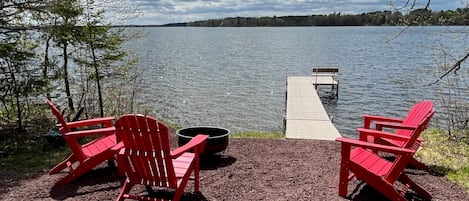 Private dock and shoreline with fire pit