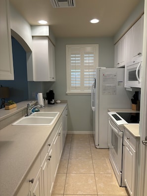 The kitchen stocked with basics we have coffee pot and keurig