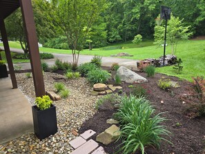 Entrance to apartment within intimate garden setting.