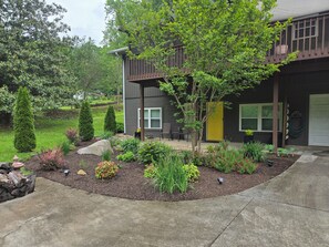Entrance to apartment within intimate garden setting.