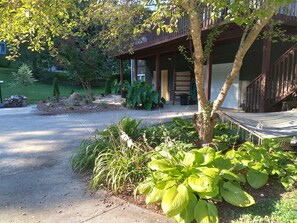 Apartment driveway entrance with landscaping