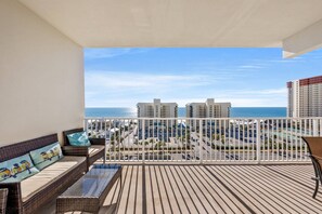 Enjoy the large covered balcony in the sky with views of the city action and beach access just across the street.