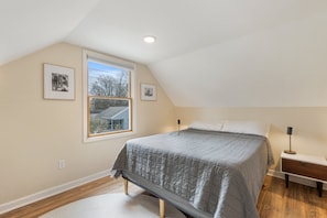 Loft master bedroom with queen bed. 