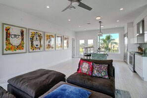 Living room and dining room - Open concept family area featuring eclectic art