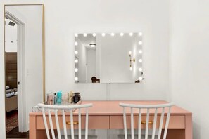 The double vanity and lighted mirror offers the perfect place to do makeup, hair or simply getting ready for a night out on Broadway!
