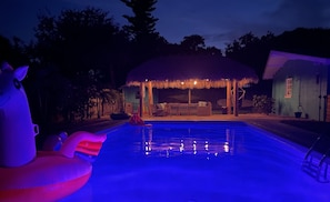 The soft magical glow of the pool &  a just-right setting for a nighttime dip