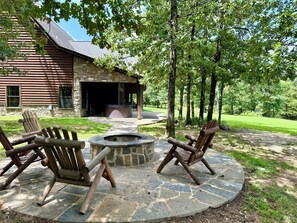 Outdoor hot tub on master suite patio, fire pit with a wood supply to enjoy.