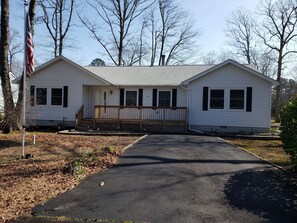 Open yard and porch overlooking the road and friendly neighbors!