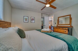 The king bedroom has a lovely antique dresser with large mirror, extra plugs and USB ports, as well as a sound machine to assist in quiet and restful sleep. Each of our three bedrooms has a luggage rack for easy unpacking.