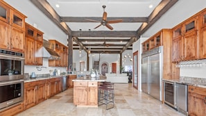 Gourmet Retreat: Where Rustic Elegance Meets Modern Luxury...the fully-stocked kitchen boasts an expansive layout, top-of-the-line appliances, and beautiful craftsmanship. Enjoy a luxurious cooking experience where memories are always made