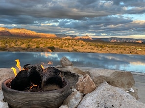 Fireside Zen: Red Rock Sunsets & Starlit Nights. A serene experience guests can expect, appealing to those seeking a tranquil retreat in nature with breathtaking views.