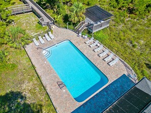 Community pool is located between the home and the beach 