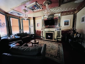 2nd living room. Fireplace, 55 inch smart TV, l;ots of light. small bar. 