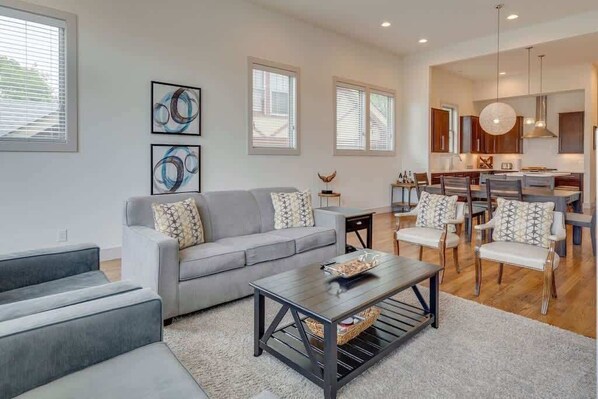 Living Room: Bright and airy space with chic decor, perfect for relaxing after Nashville adventures!