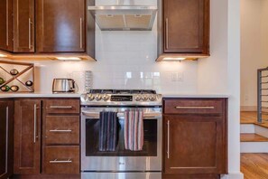 Gourmet Kitchen: Cook up a feast with modern appliances and stylish oak cabinetry in Nashville!