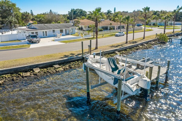 1830 Riverside Drive E is the blue house with boat dock and lift