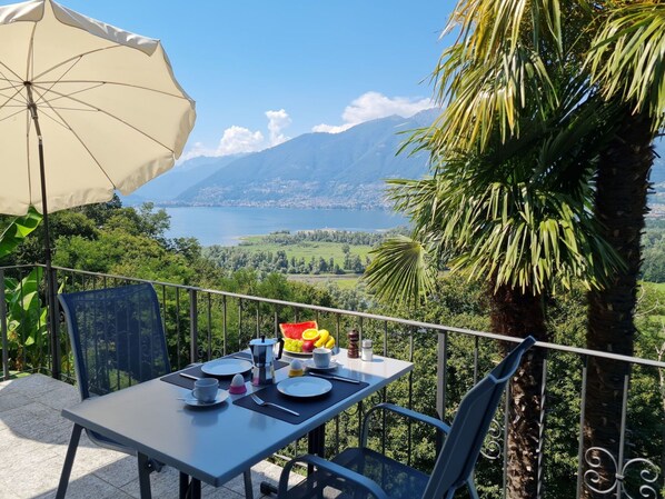 Table, Furniture, Sky, Property, Plant, Building, Chair, Cloud, Azure, Outdoor Furniture