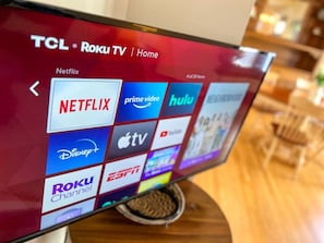 UHD Roku smart TV with streaming services pre-installed.