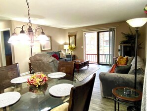 Dining plus living room overlooking patio