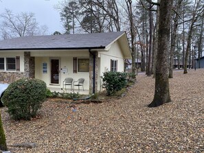 Front porch with sitting area and large side yard for your enjoyment