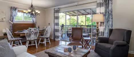 Large sliding glass doors open to the partially covered patio. 