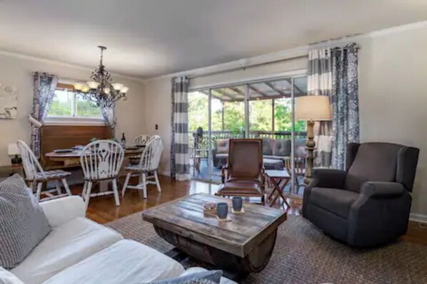 Large sliding glass doors open to the partially covered patio. 