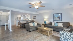 Open, bright living space to dining area