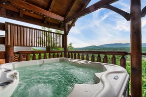 Enjoy the outdoor hot tube providing an unbeatable view of GSMNP