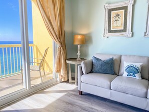 Living room with queen sleeper sofa and breathtaking gulf views