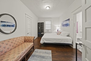 king bed, sofa, and desk