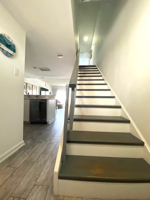 View from front door showing downstairs and stairs to bedrooms/bath upstairs.