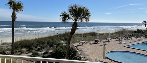 Beautiful views of Crescent beach and pool area from condo balcony!