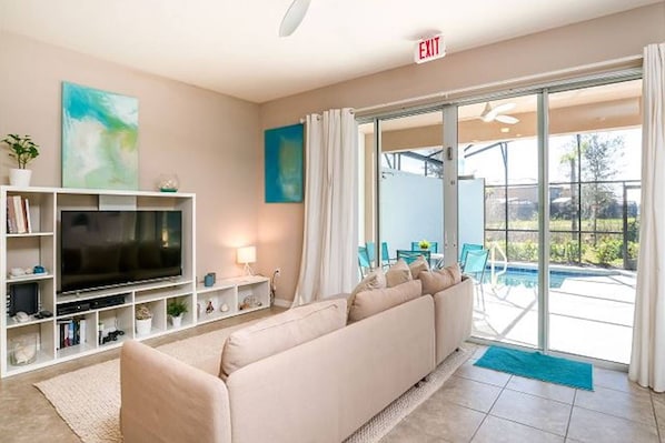 Unique Living Room Décor, 60" Flat Screen TV and Loads of Sunshine!