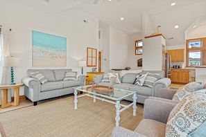 Seaside family room with cozy sofas and beachy charm!