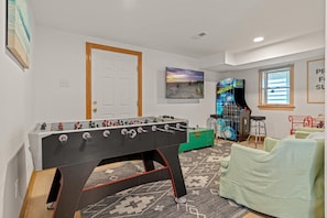 Game room blast! Foosball goals, arcade wins, cozy couch—playtime rocks!
