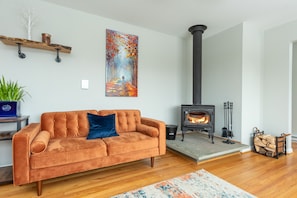 Enjoy a woodstove and sit on the "magic couch" while enjoying Mountain Views