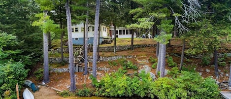 View of sandy beach and waterfront. 