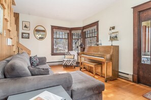 Added cozy living space with vintage piano