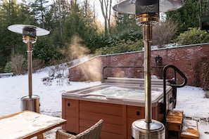 Relax in the hot tub in the back yard