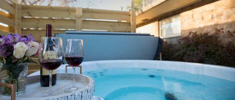 Have a glass of wine while relaxing in the hot tub