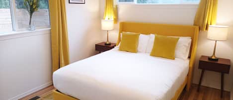This is the Mustard Yellow Room with a queen bed.
