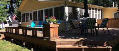 Spacious wrap-around deck with outdoor dining table